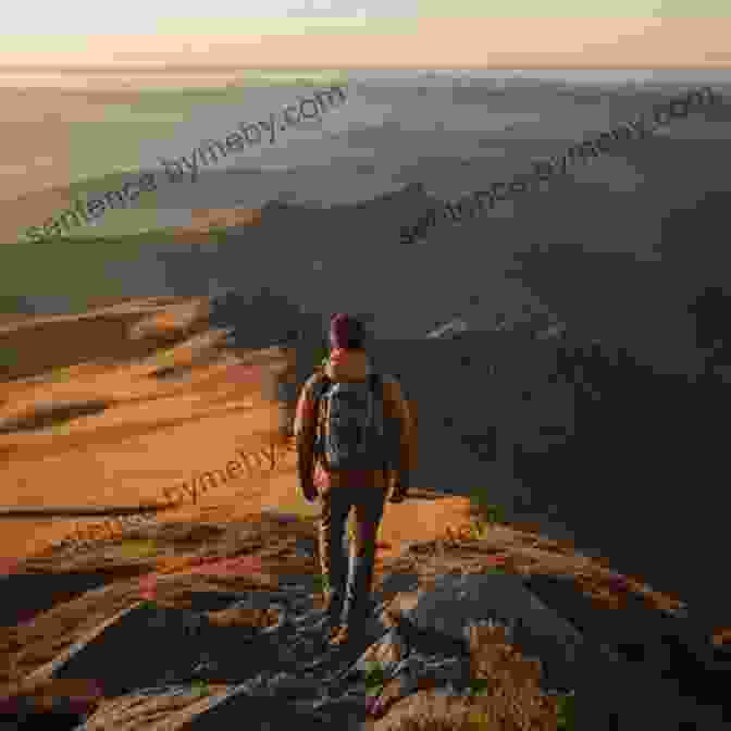 A Hiker Stands On A Ridge Overlooking A Vast Wilderness Landscape Of Mountains, Lakes, And Forests. Torngat Mountains A New Waiver: A Northwords Story