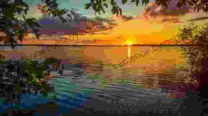 A Panoramic View Of A Tranquil New England Lake, With A Lone Angler Casting From The Shore, Surrounded By Vibrant Foliage And Distant Mountain Peaks. Flyfisher S Guide To New England: Maine New Hampshire Vermont Massachusetts