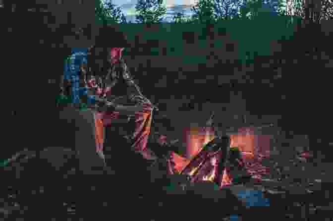 An Image Of John Craig Sitting By A Campfire In The Everglades Our Watery Way: Canoe Sailing In Rivers Of Mud