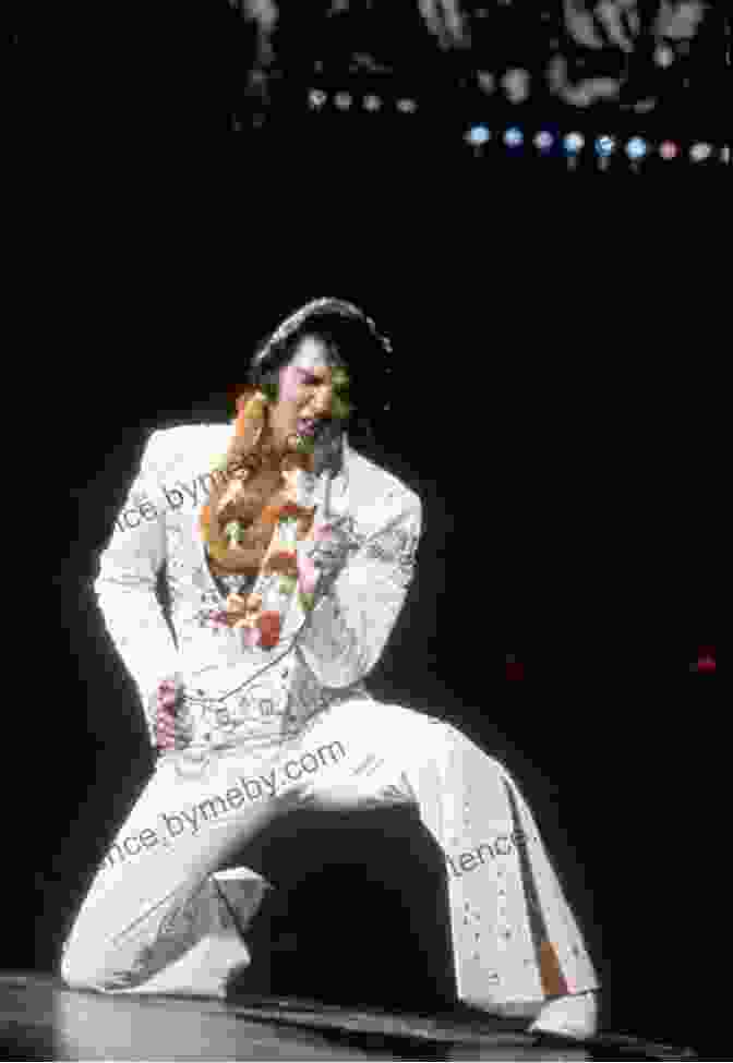 Elvis Presley Performing On Stage In His Signature White Jumpsuit Tupac Shakur: The Life And Times Of An American Icon